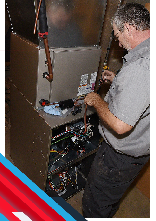service tech working on a furnace