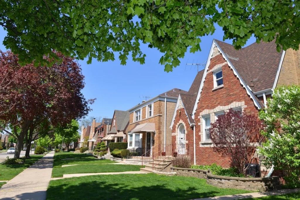 Typical Midwest USA city suburbs neighborhood on a nice spring day. White lilac blooms.